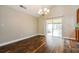 Bright and airy dining room featuring hardwood floors and sliding glass doors to the lanai at 1582 Darlington Ave, Deltona, FL 32725