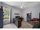 Home office with light blue walls, natural light, and an area for work and relaxation at 1726 Brackenhurst Pl, Lake Mary, FL 32746