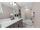 Modern bathroom with neutral tile, white countertop, and matte black hardware fixtures at 2030 Branched Oak Rd, St Cloud, FL 34771