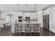 Stylish kitchen with white cabinets, a large center island, pendant lighting, and stainless steel appliances at 2030 Branched Oak Rd, St Cloud, FL 34771