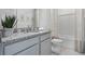 Bathroom featuring granite countertop and gray cabinets at 2124 Monteverde, Davenport, FL 33896