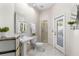 Bright bathroom with pedestal sink, walk-in shower, and natural light at 235 Nob Hill Cir, Longwood, FL 32779