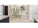 Luxurious bathroom with a glass-enclosed shower, soaking tub, and walk-in closet at 235 Nob Hill Cir, Longwood, FL 32779