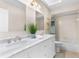 Bathroom featuring double sinks, a large mirror, a bathtub and a shower at 235 Nob Hill Cir, Longwood, FL 32779