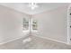 Bedroom with carpet flooring, neutral walls, two windows, and a ceiling fan at 235 Nob Hill Cir, Longwood, FL 32779