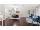 Elegant dining room featuring hardwood floors, white trim, and a stylish chandelier at 235 Nob Hill Cir, Longwood, FL 32779