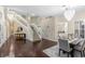 Elegant foyer with a grand staircase, chandelier, and hardwood floors at 235 Nob Hill Cir, Longwood, FL 32779