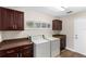 Laundry room with washer, dryer, counterspace, and upper and lower cabinets at 235 Nob Hill Cir, Longwood, FL 32779