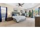 Spacious main bedroom features plush carpeting, ensuite bathroom, and serene views of the backyard at 235 Nob Hill Cir, Longwood, FL 32779