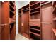 Walk-in closet with custom shelving and drawers, providing ample storage space at 235 Nob Hill Cir, Longwood, FL 32779