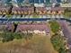 An aerial view shows a neighborhood with multiple residential townhome buildings and green spaces and parking at 2511 Calabria Ave, Davenport, FL 33897