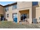 View of the back of the house with a patio and some grass at 2511 Calabria Ave, Davenport, FL 33897