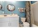 Stylish bathroom featuring a sink, toilet, and shower with a decorative curtain at 2511 Calabria Ave, Davenport, FL 33897