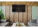 Close up of living room media center with unique slat-style partition and plants at 2511 Calabria Ave, Davenport, FL 33897