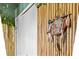 A decorative wall hanging featuring beads, feathers, and an animal design at 2511 Calabria Ave, Davenport, FL 33897