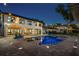 Evening shot of the backyard showing the pool, patio, and exterior of the home at 3120 Downs Cove Rd, Windermere, FL 34786