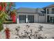 Modern home with a sleek two-car garage featuring frosted glass doors and a paver driveway at 3120 Downs Cove Rd, Windermere, FL 34786