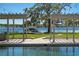 Beautiful lakeside swimming pool with string lights, pergola, and boat house at 3120 Downs Cove Rd, Windermere, FL 34786