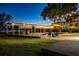 Gorgeous pool at twilight, featuring a covered lounge area, string lights and brick pavers at 3120 Downs Cove Rd, Windermere, FL 34786