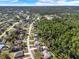 Expansive aerial view of a neighborhood next to a beautiful nature preserve at 3200 Utah Dr, Deltona, FL 32738