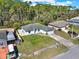 Aerial view of home with well-manicured lawn and mature trees at 3200 Utah Dr, Deltona, FL 32738