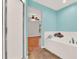 Inviting bathroom showing a tub and open doorway at 3200 Utah Dr, Deltona, FL 32738