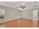 Spacious bedroom featuring wood floors, natural light, and ceiling fan at 3200 Utah Dr, Deltona, FL 32738