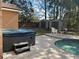 View of a private backyard with a hot tub, pool and storage sheds at 3220 Town And Country Rd, Oviedo, FL 32766