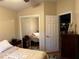 Cozy bedroom with mirrored closet doors and neutral decor at 3220 Town And Country Rd, Oviedo, FL 32766