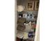 Linen closet filled with towels, cleaning supplies and toiletries at 3220 Town And Country Rd, Oviedo, FL 32766