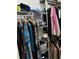 Well-organized closet with rods and shelves filled with clothing and accessories at 3220 Town And Country Rd, Oviedo, FL 32766