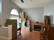 Bright living room featuring hardwood floors, a decorative fireplace, and a large window at 3220 Town And Country Rd, Oviedo, FL 32766