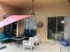 Covered patio with comfortable seating and sliding glass doors leading inside at 3220 Town And Country Rd, Oviedo, FL 32766