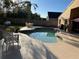 View of a private pool in a fenced yard with comfortable lounge seating at 3220 Town And Country Rd, Oviedo, FL 32766