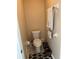 Bathroom featuring a toilet with wall decorations, and a garbage can next to it at 3220 Town And Country Rd, Oviedo, FL 32766