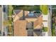 Bird's eye view of the meticulously maintained property including the roof, patio, and driveway at 4038 Hunters Park Ln, Orlando, FL 32837