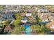 An aerial view of the community pool and the back gate of the property at 4038 Hunters Park Ln, Orlando, FL 32837