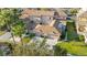 Real estate aerial view showcasing house exterior, lawn, and attached two car garage at 4038 Hunters Park Ln, Orlando, FL 32837