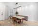 Bright dining room featuring modern chandelier, large windows, and contemporary furniture at 4038 Hunters Park Ln, Orlando, FL 32837