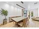 Bright dining room features modern fireplace and large windows leading to the patio at 4038 Hunters Park Ln, Orlando, FL 32837