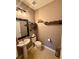 Small bathroom featuring a pedestal sink, toilet, and themed decor on floating shelves at 4113 Golden Willow Cir, Apopka, FL 32712