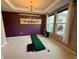 Game room has a chandelier and access to putting green at 4113 Golden Willow Cir, Apopka, FL 32712