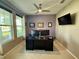 Cozy home office is well-lit and has a large desk at 4113 Golden Willow Cir, Apopka, FL 32712