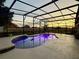 Stunning screened pool with beautiful sunset views makes for the perfect backyard oasis at 4113 Golden Willow Cir, Apopka, FL 32712