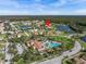 Aerial view of the neighborhood featuring community amenities, residential homes, and lush green landscaping at 4119 Navigator Way, Kissimmee, FL 34746