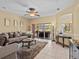 Cozy living room featuring a ceiling fan, sliding glass doors to the lanai, and comfortable seating at 4119 Navigator Way, Kissimmee, FL 34746