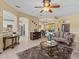 Open concept living room featuring tile floors and views to the kitchen and dining room at 4119 Navigator Way, Kissimmee, FL 34746