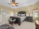 Main bedroom featuring a luxurious bed, side tables, and windows that provide plenty of natural light at 4119 Navigator Way, Kissimmee, FL 34746