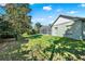 A view of the house shows a well-maintained lawn and screened pool enclosure at 4537 Woodlands Village Dr, Orlando, FL 32835