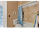 Bathroom featuring a shower and tub with tile surround and a blue floral shower curtain at 4537 Woodlands Village Dr, Orlando, FL 32835